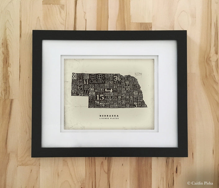 Nebraska License Plate Poster – Warm Black on Cream Background